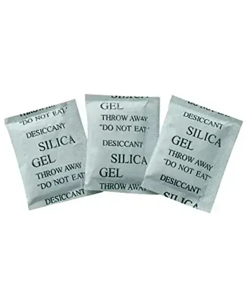 Three silica gel sachets printed with "SILICA GEL", "DESICCANT" and "DO NOT EAT", on a white background.